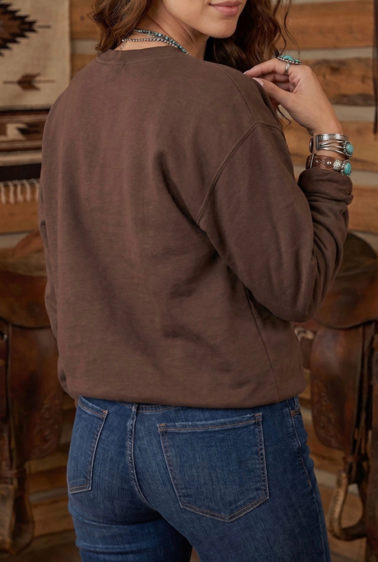 Pray Parchwork on a brown sweatshirt